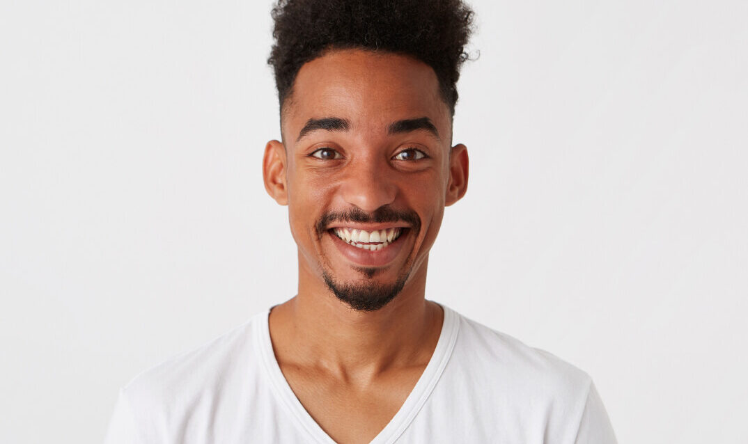 portrait-cheerful-attractive-african-american-young-man 1-1 portrait-cheerful-attractive-african-american-young-man 1-1